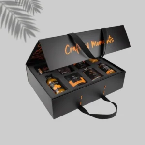 A luxurious black gift box filled with an assortment of gourmet foods, perfect for a special occasion or celebration.