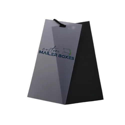 Custom brand clothing hang tags featuring a frosted PVC overlay and a black cardboard backing for premium product labelling.
