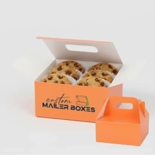 two custom mailer boxes for cookies in a vibrant orange color with "custom MAILER BOXES" text, one open to show chocolate chip cookies inside, ideal for gifts.