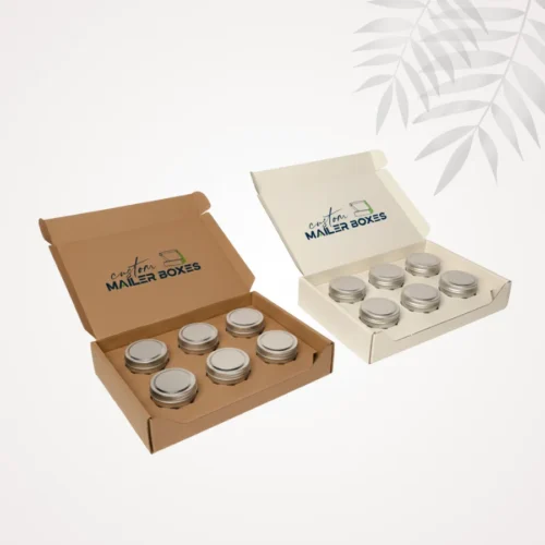 Pair of candle mailer boxes, one brown and one white, both holding six metal candle tins secured by custom 6-cell cardboard inserts for shipping.