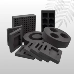 Black die-cut foam packaging insert with an intricately-shaped cavity, used for protective shipping of sensitive instruments or precision tools.