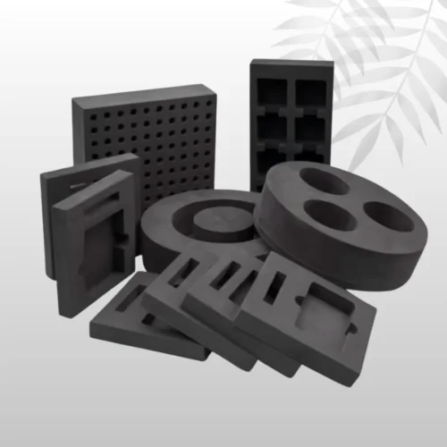 Black die-cut foam packaging insert with an intricately-shaped cavity, used for protective shipping of sensitive instruments or precision tools.