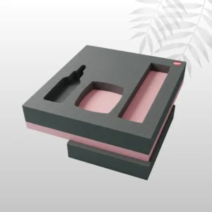 Custom-molded polyurethane foam insert, white, cut to perfectly cushion and secure a fragile electronic device inside its retail box.