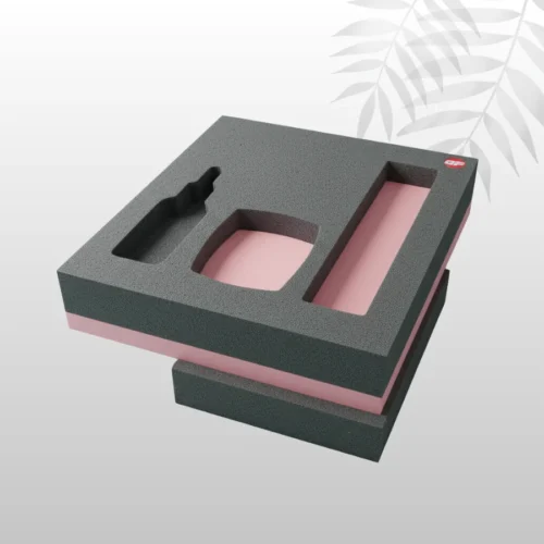 Custom-molded polyurethane foam insert, white, cut to perfectly cushion and secure a fragile electronic device inside its retail box.