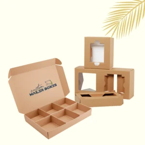 Open corrugated cardboard mailer box with internal 9-cell dividers and a stack of individual brown die-cut box inserts with windows (packaging box dividers & inserts), showcasing custom packaging solutions for multiple products.