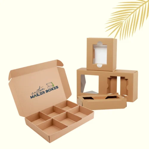 Open corrugated cardboard mailer box with internal 9-cell dividers and a stack of individual brown die-cut box inserts with windows (packaging box dividers & inserts), showcasing custom packaging solutions for multiple products.