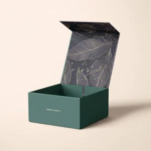 Sophisticated open teal magnetic closure luxury rigid boxes with "EVERLINE COSMETICS" branding and a gold leaf pattern on the inner lid.