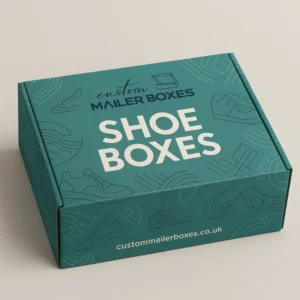 Closed custom-printed dark green cardboard shoe box with white text and light green abstract line art, including shoe outlines.